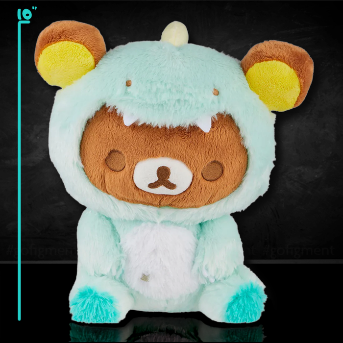 Rilakkuma plush dressed in pastel green dinosaur costume with San-X branding on black background