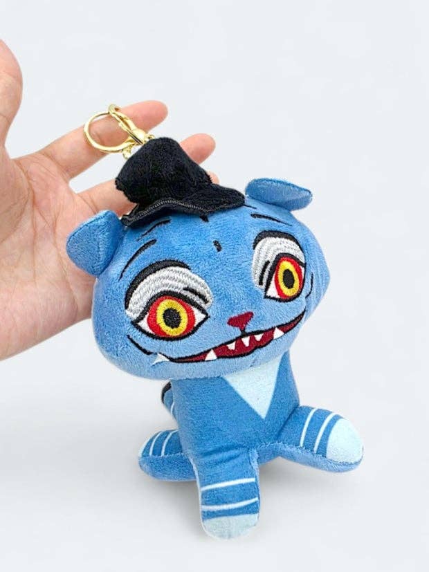 K-Wonderland plush keyring featuring a blue tiger character with vibrant embroidered eyes and a black hat accessory