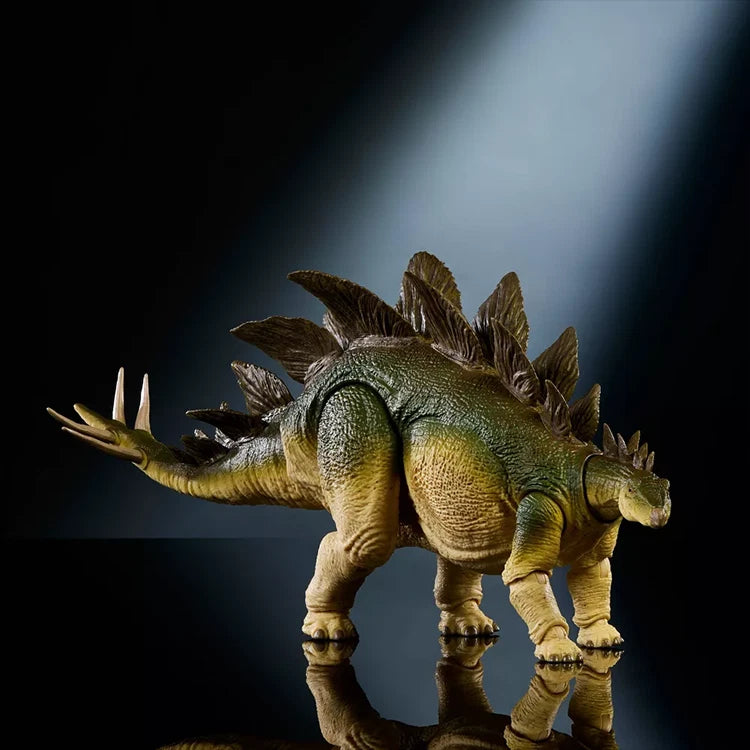 Jurassic World Hammond Collection Stegosaurus figure by Mattel with detailed plates and posable tail in dramatic lighting.