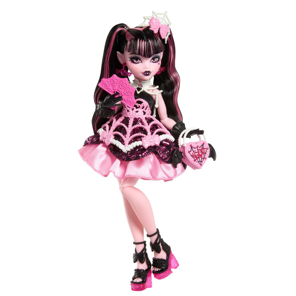 Mattel Monster High Draculaura doll in pink and black spiderweb dress with accessories for a spooky birthday party.