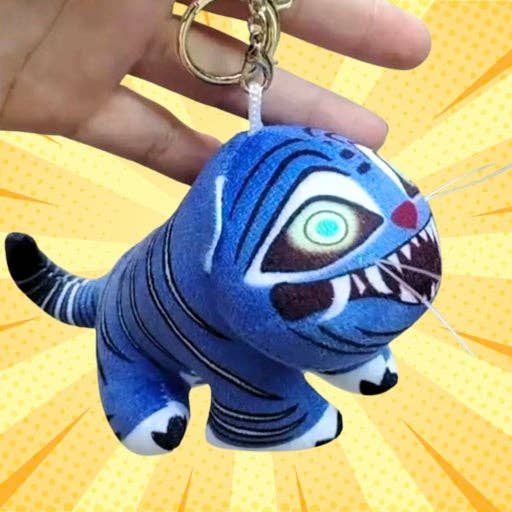 K-Wonderland K-Pop Hunters tiger plush keyring with vibrant blue stripes and embroidered fierce face held against yellow burst background