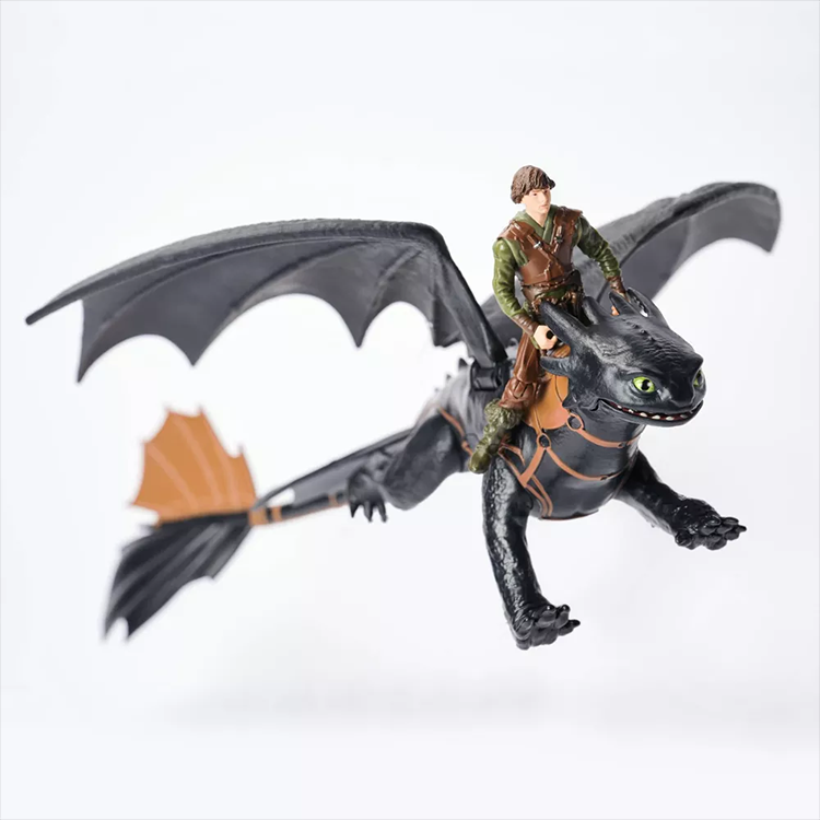 Spin Master How to Train Your Dragon action figure set featuring Hiccup riding Toothless in flight pose on white background