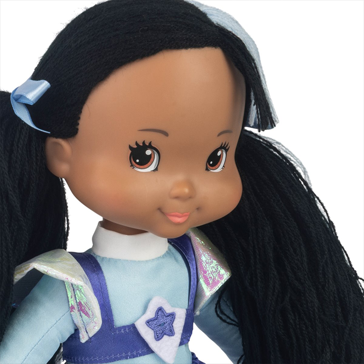 Close-up of Indigo plush doll from The Loyal Subjects in detailed costume with expressive embroidered face and black yarn hair