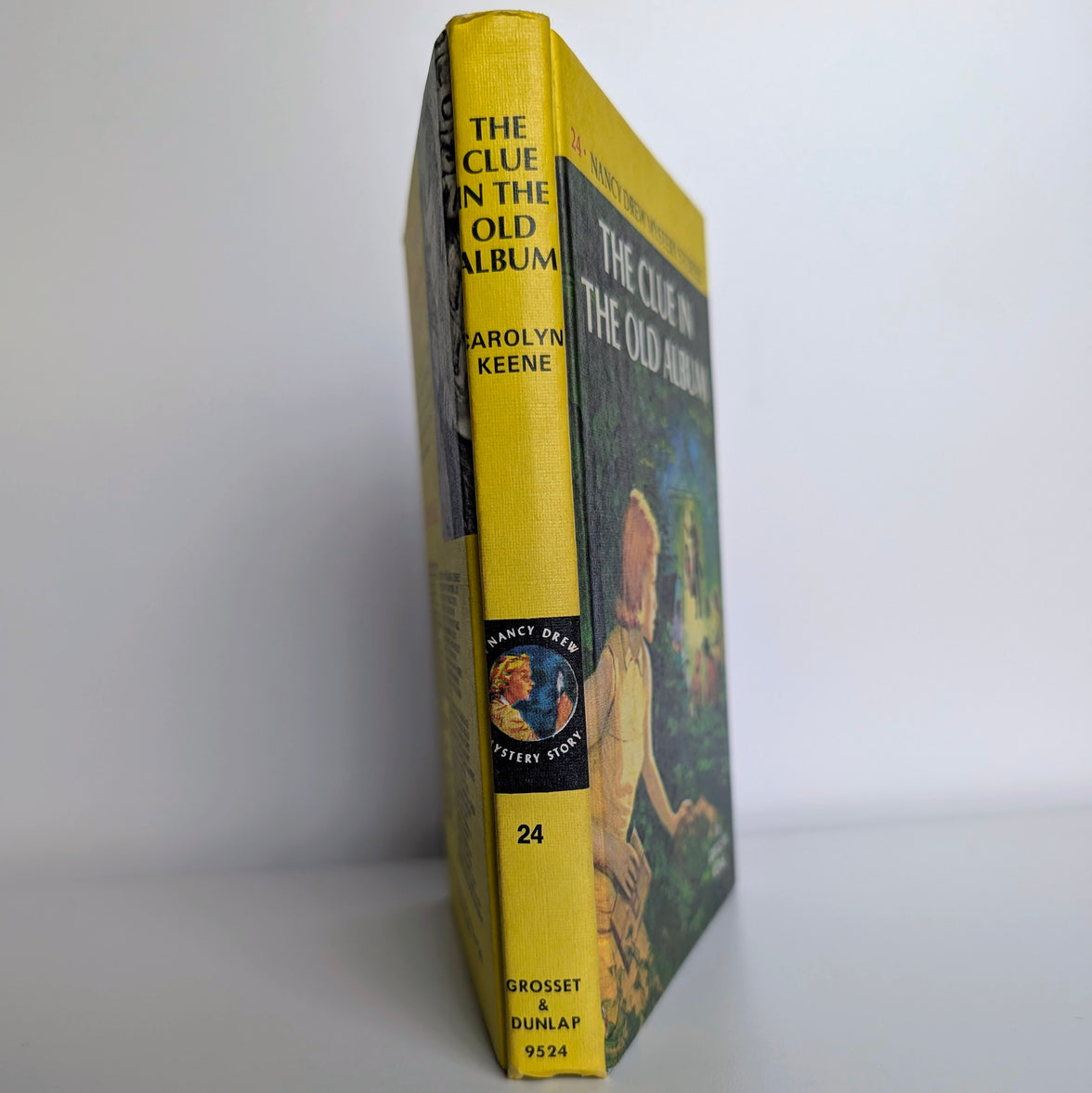 Vintage Grosset & Dunlap Nancy Drew Mystery #24 The Clue in the Old Album yellow bar edition book spine view