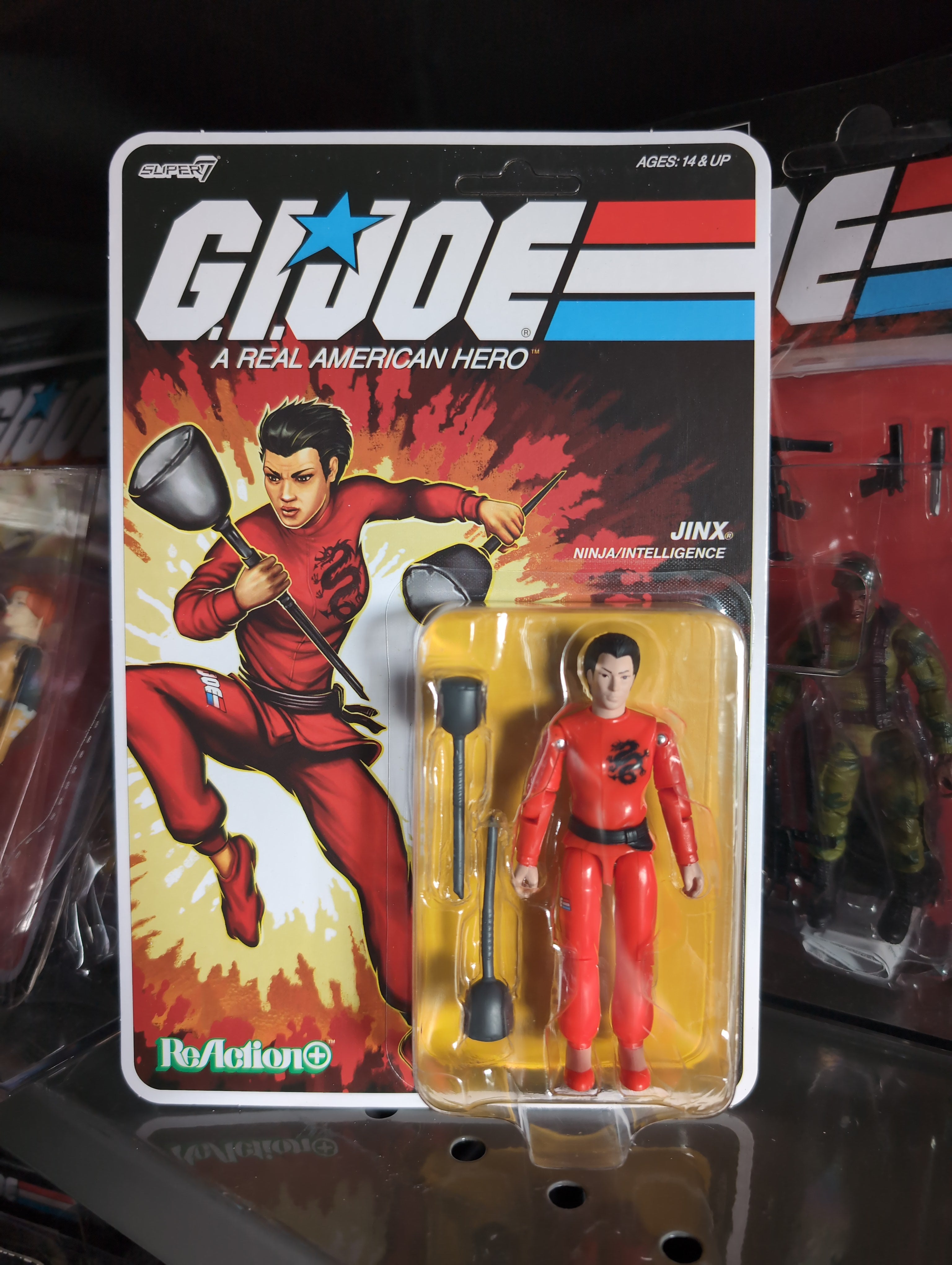 Hasbro G.I. Joe Jinx action figure in red ninja outfit with sparring batons in vintage style packaging