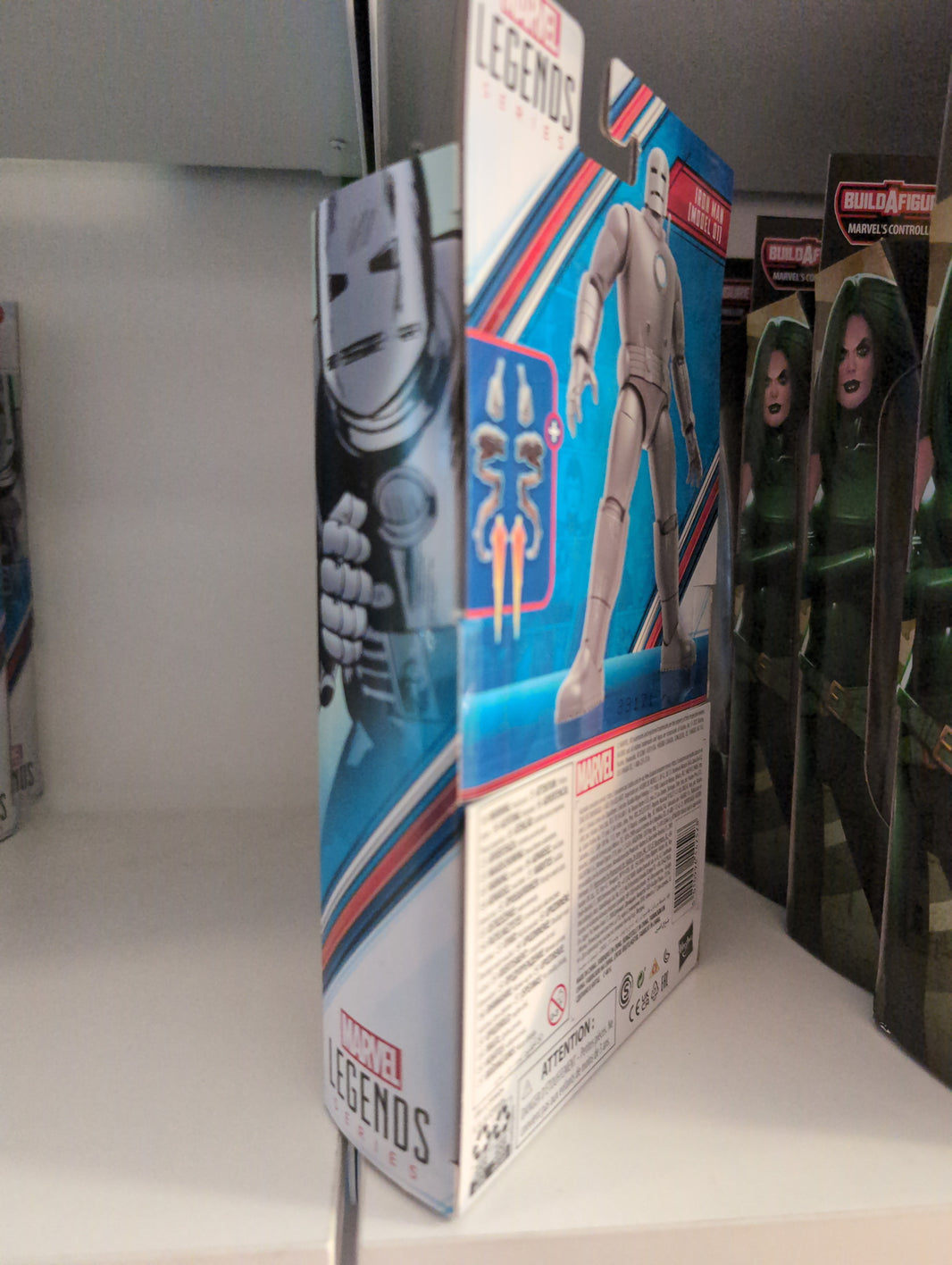 Marvel Legends Hasbro Iron Man Model 01 action figure in box showing accessories and detailed packaging side view