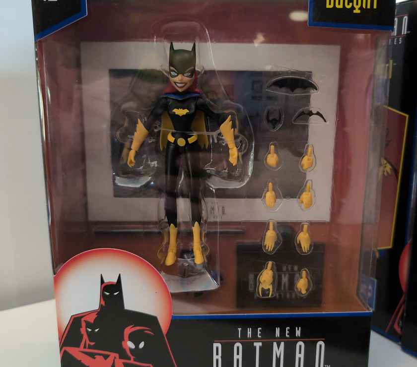 McFarlane Batgirl 6-inch action figure from The New Batman Adventures with multiple hands and accessories in display box.