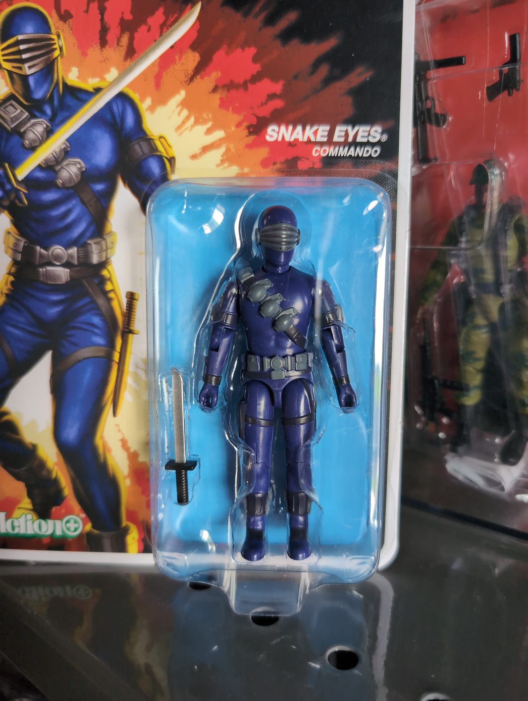 Hasbro Snake Eyes Commando blue G.I. Joe action figure with sword in vintage style packaging