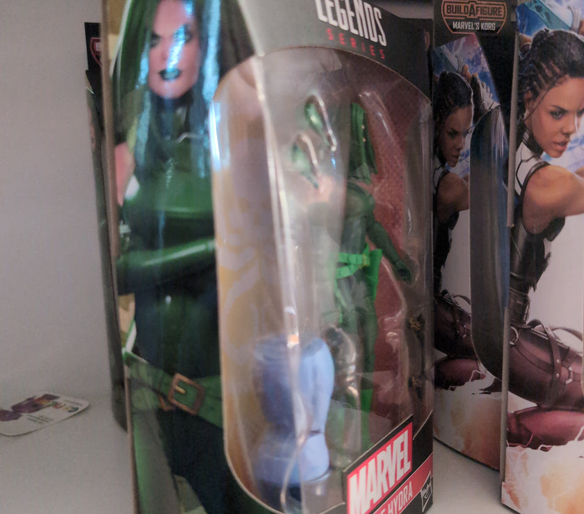 Hasbro Marvel Legends Madame Hydra action figure in classic green outfit with pistols and alternate hands in packaging