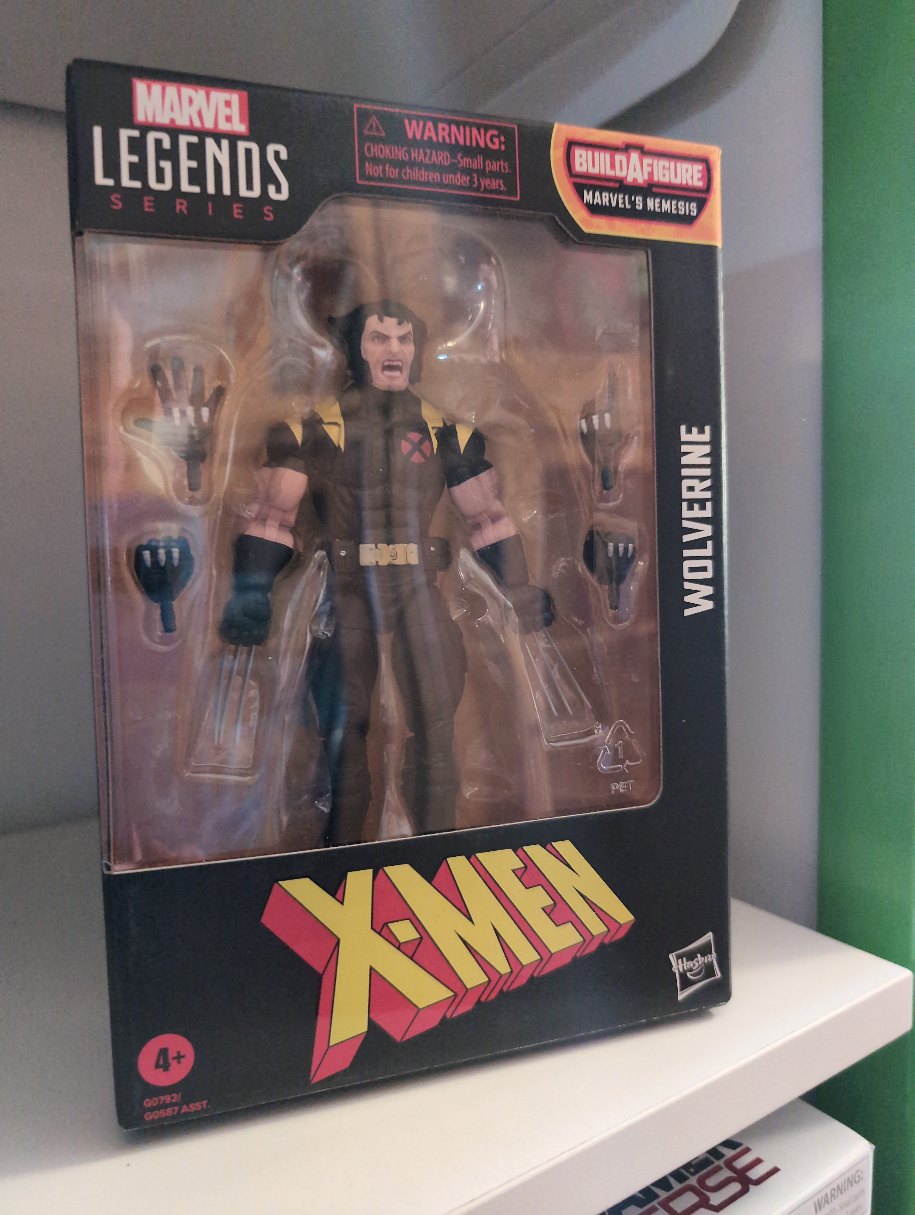 Hasbro Marvel Legends Wolverine X-Men 6-inch action figure with multiple hands in original packaging.