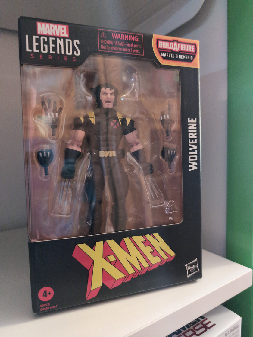 Hasbro Marvel Legends Wolverine X-Men 6-inch action figure with multiple hands in original packaging.