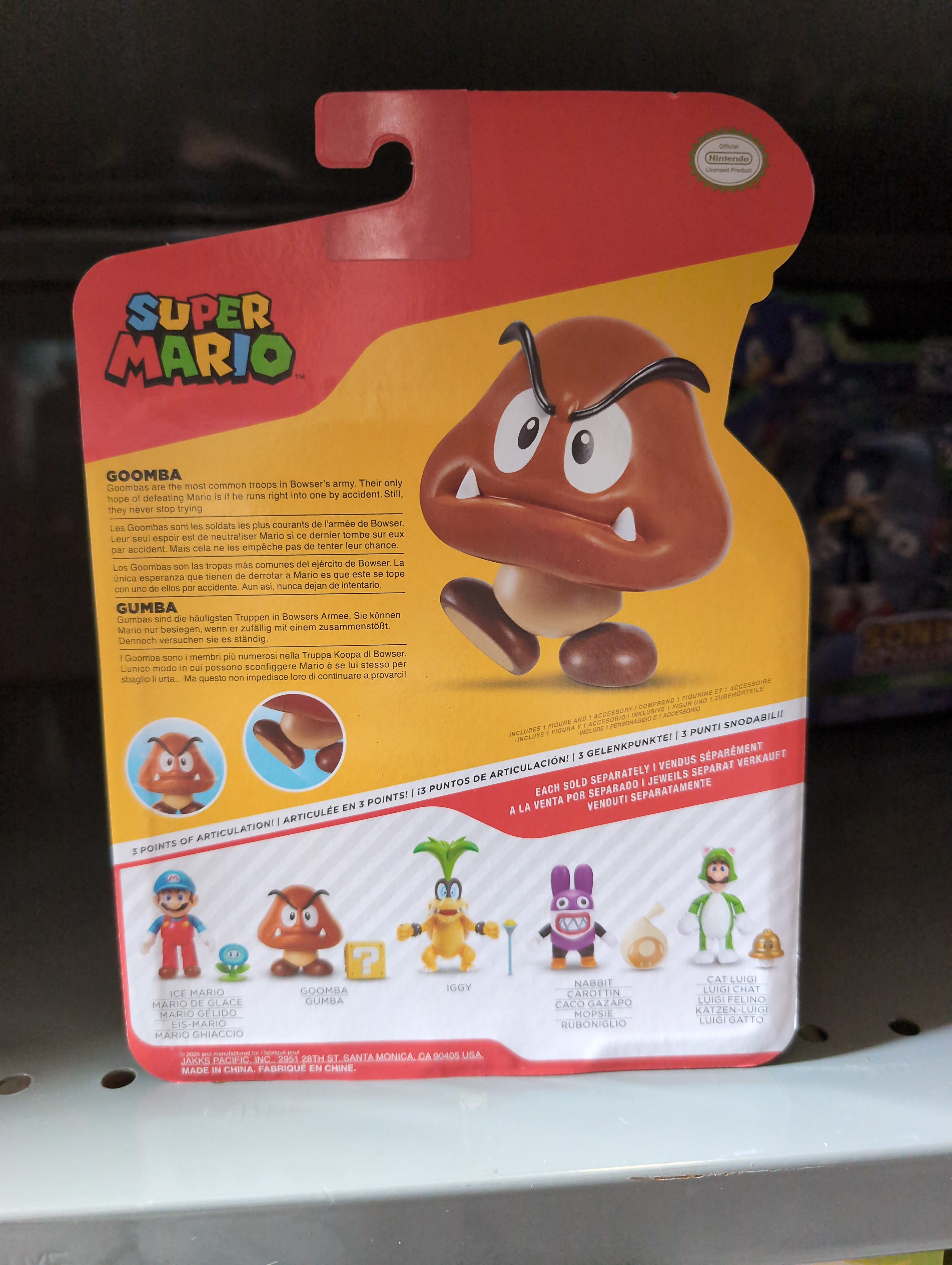 Packaging back of Super Mario Wave 49 - Goomba with ? Block 4" Action Figure Collectible by Jakks with character details and other figures shown.