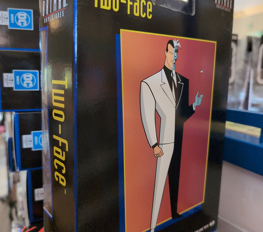McFarlane Two-Face action figure packaging featuring stylized animated character from The New Batman Adventures series.