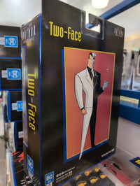 McFarlane Two-Face action figure packaging featuring stylized animated character from The New Batman Adventures series.
