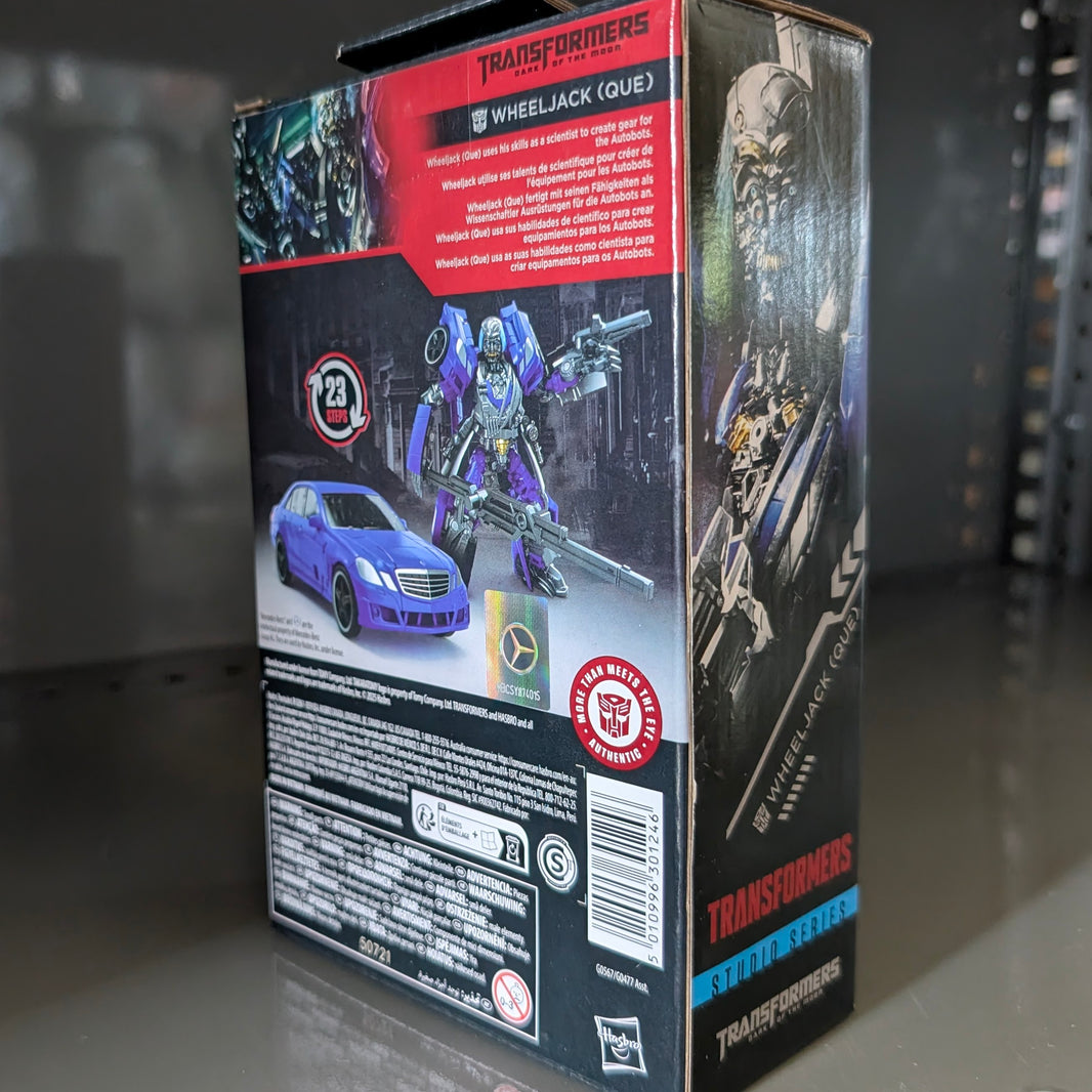 Packaging box showing Wheeljack Transformers:Dark of the Moon Studio Series Action Figure by Hasbro with vehicle and robot modes.