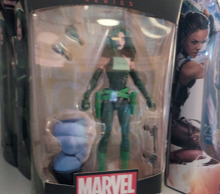 Hasbro Marvel Legends Madame Hydra action figure with accessories and Build-A-Figure piece in collectible packaging.