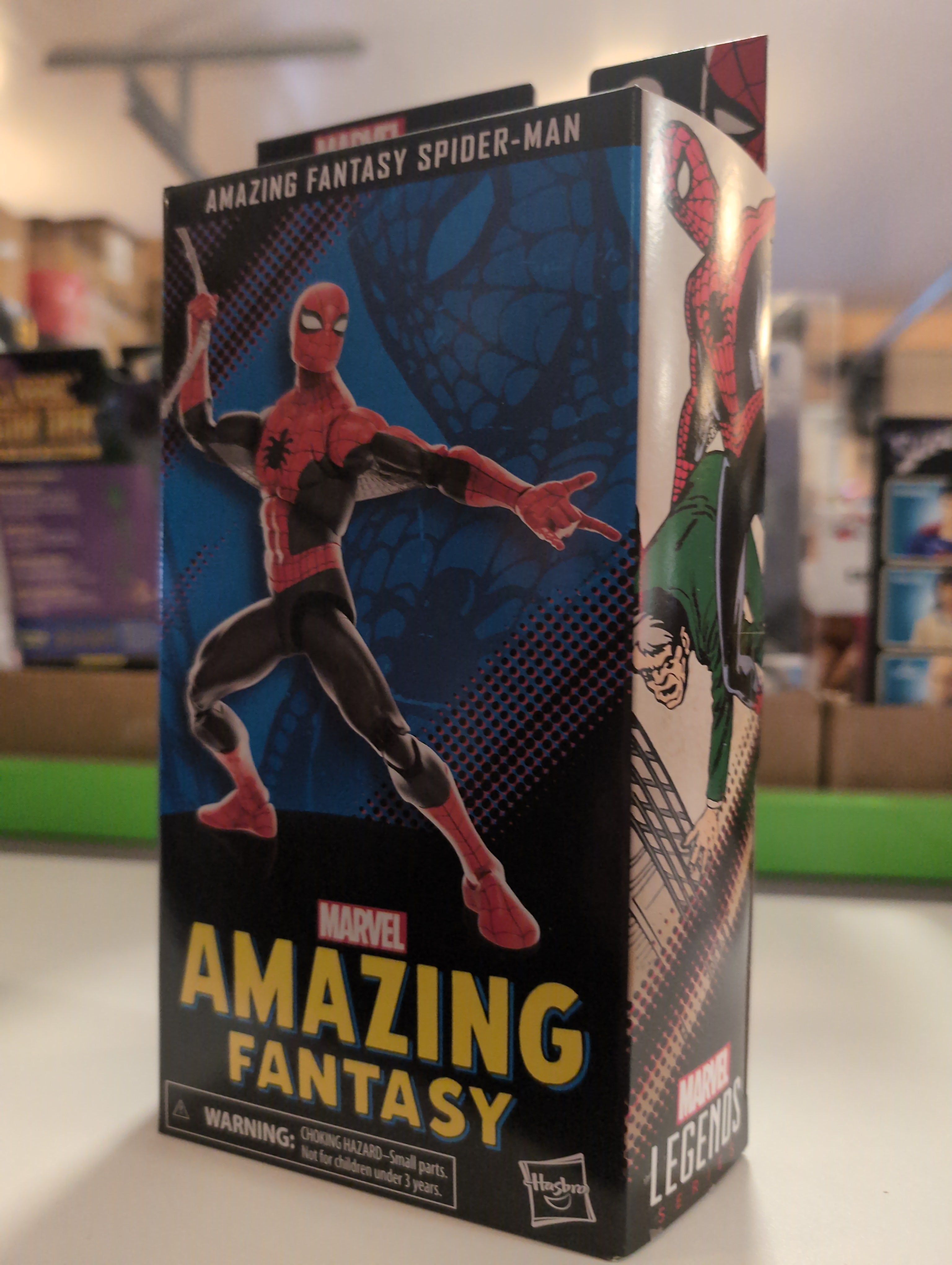 Hasbro Marvel Legends 6-inch Amazing Fantasy Spider-Man action figure packaging with classic comic art design.
