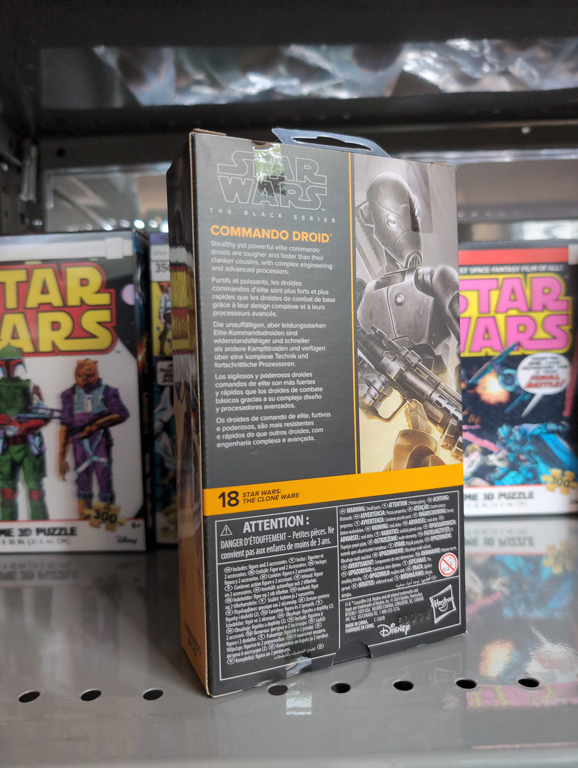 Hasbro Star Wars Black Series Commando Droid 1:12 scale action figure packaging with product details on shelf.