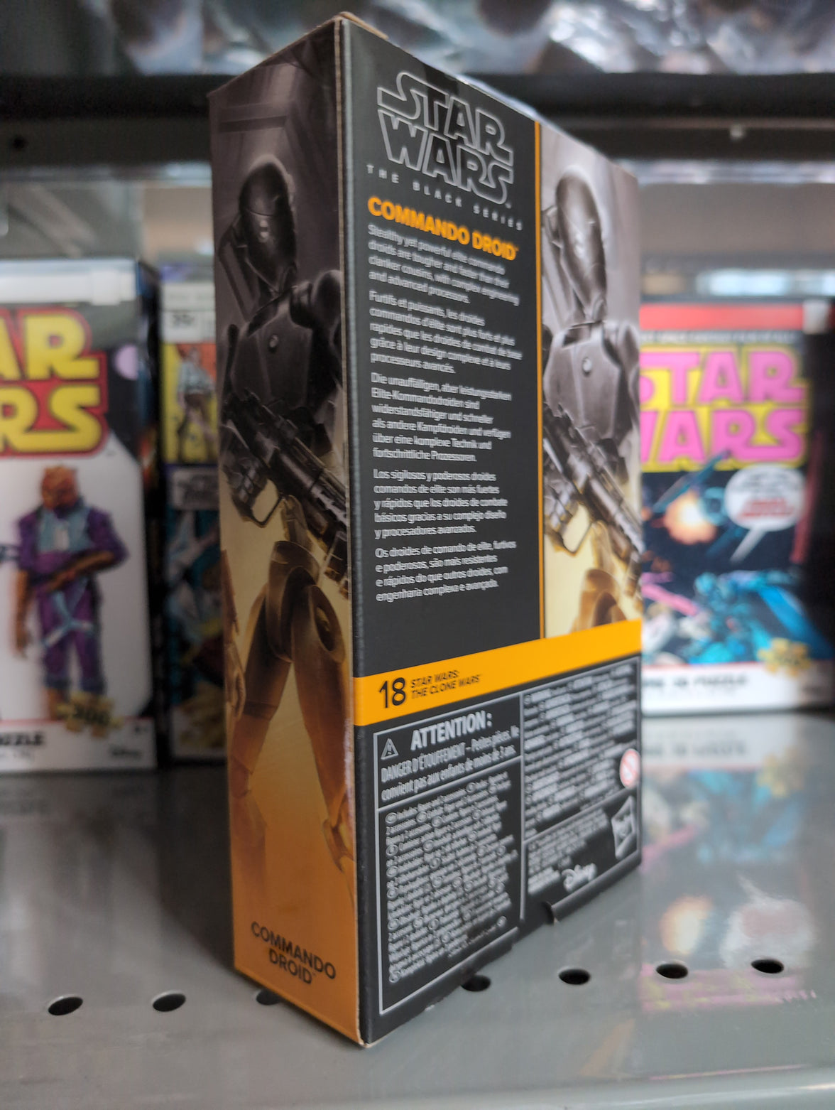 Hasbro Star Wars Black Series Commando Droid action figure packaging with detailed product description on shelf.