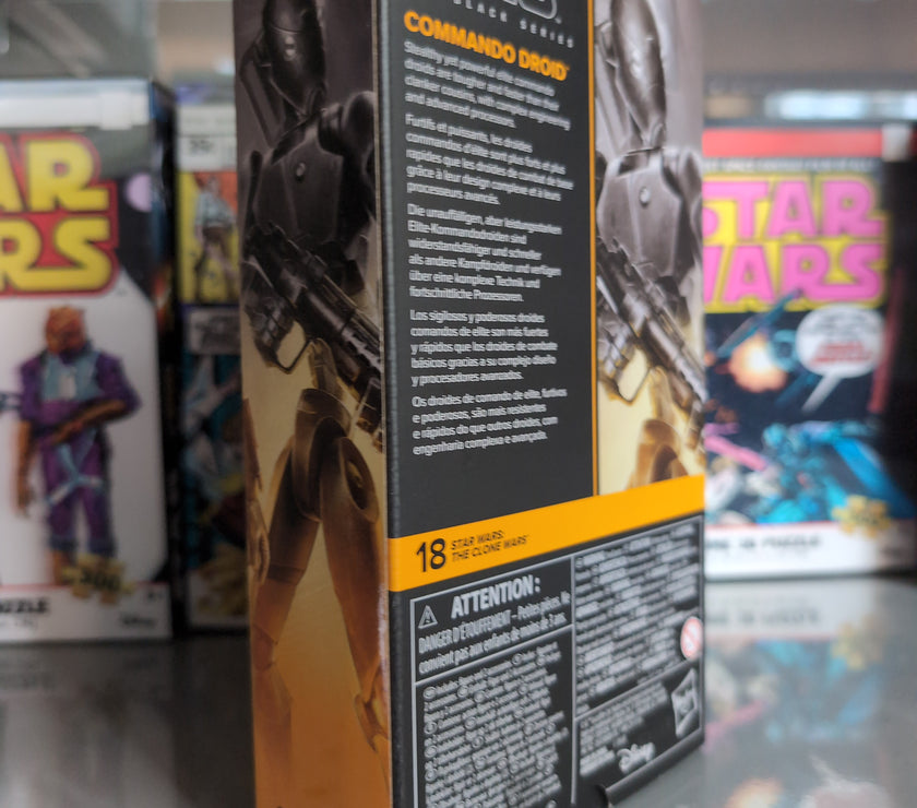 Hasbro Star Wars Black Series Commando Droid action figure packaging with detailed product description on shelf.