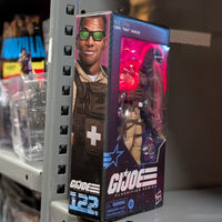 Hasbro GI Joe Classified Series Carl Doc Greer 6-inch action figure in packaging displayed on metal shelf
