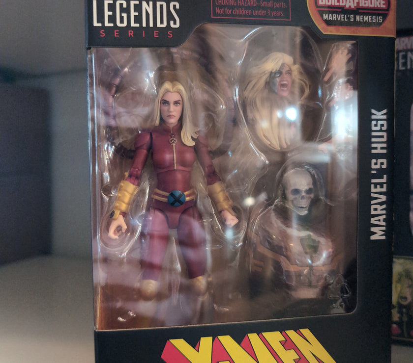 Hasbro Marvel Legends Husk action figure in original packaging with accessories from X-Men series.