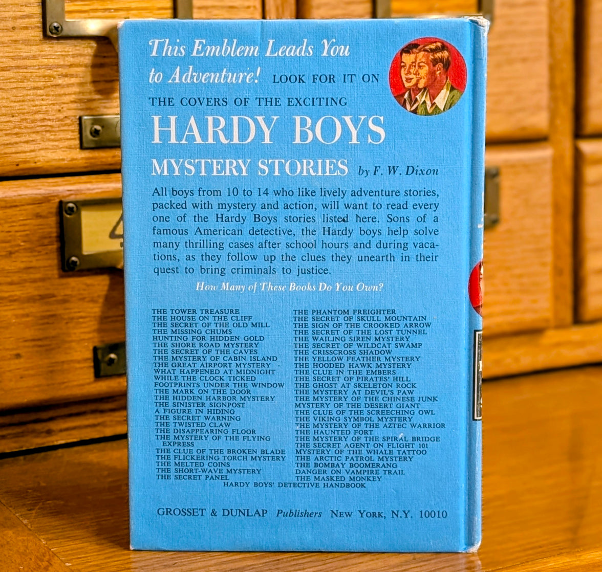 Back cover of Hardy Boys book 21 The Clue of the Broken Blade published by Grosset & Dunlap, Inc.