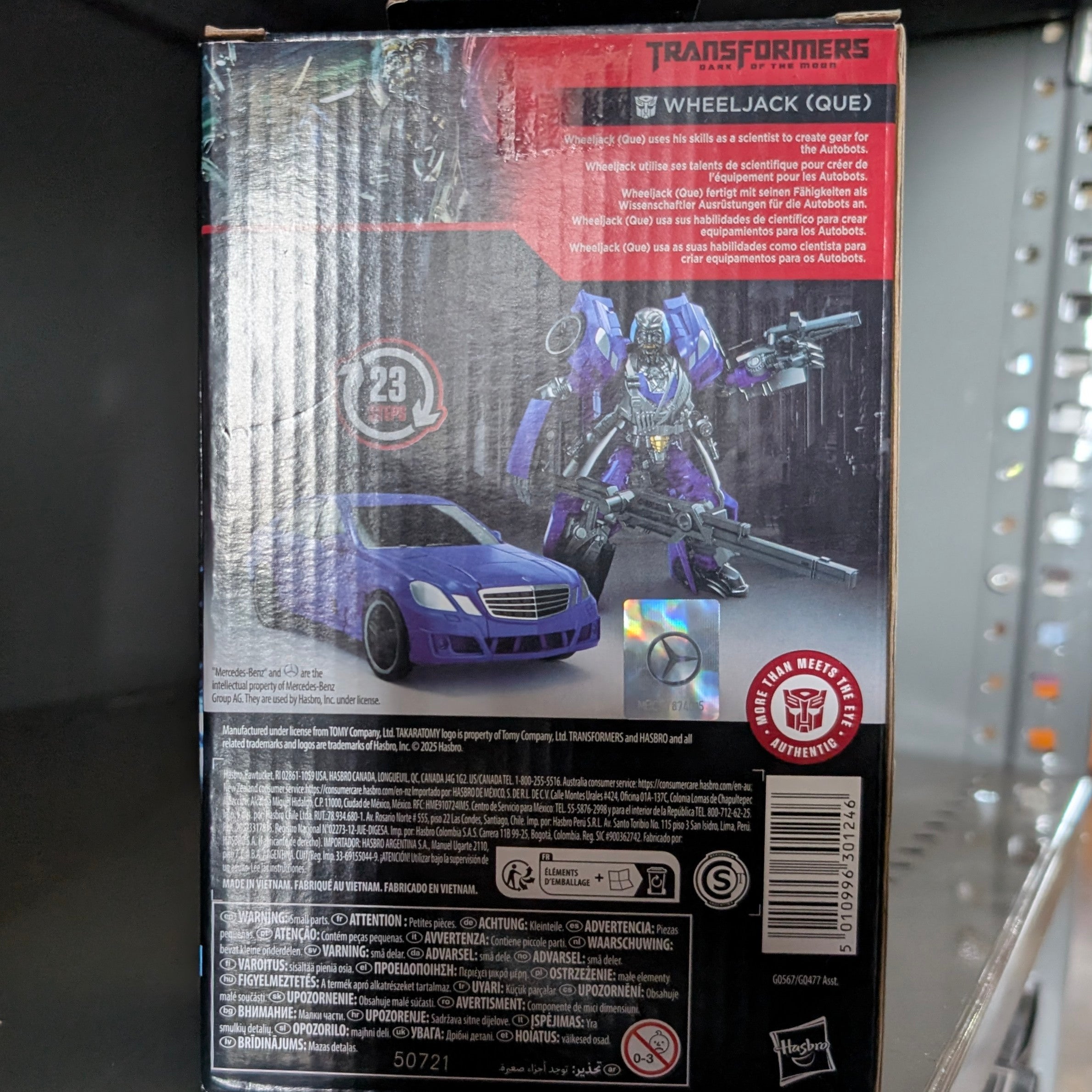 Packaging showing the Wheeljack Transformers:Dark of the Moon Studio Series Action Figure by Hasbro with vehicle and robot modes.