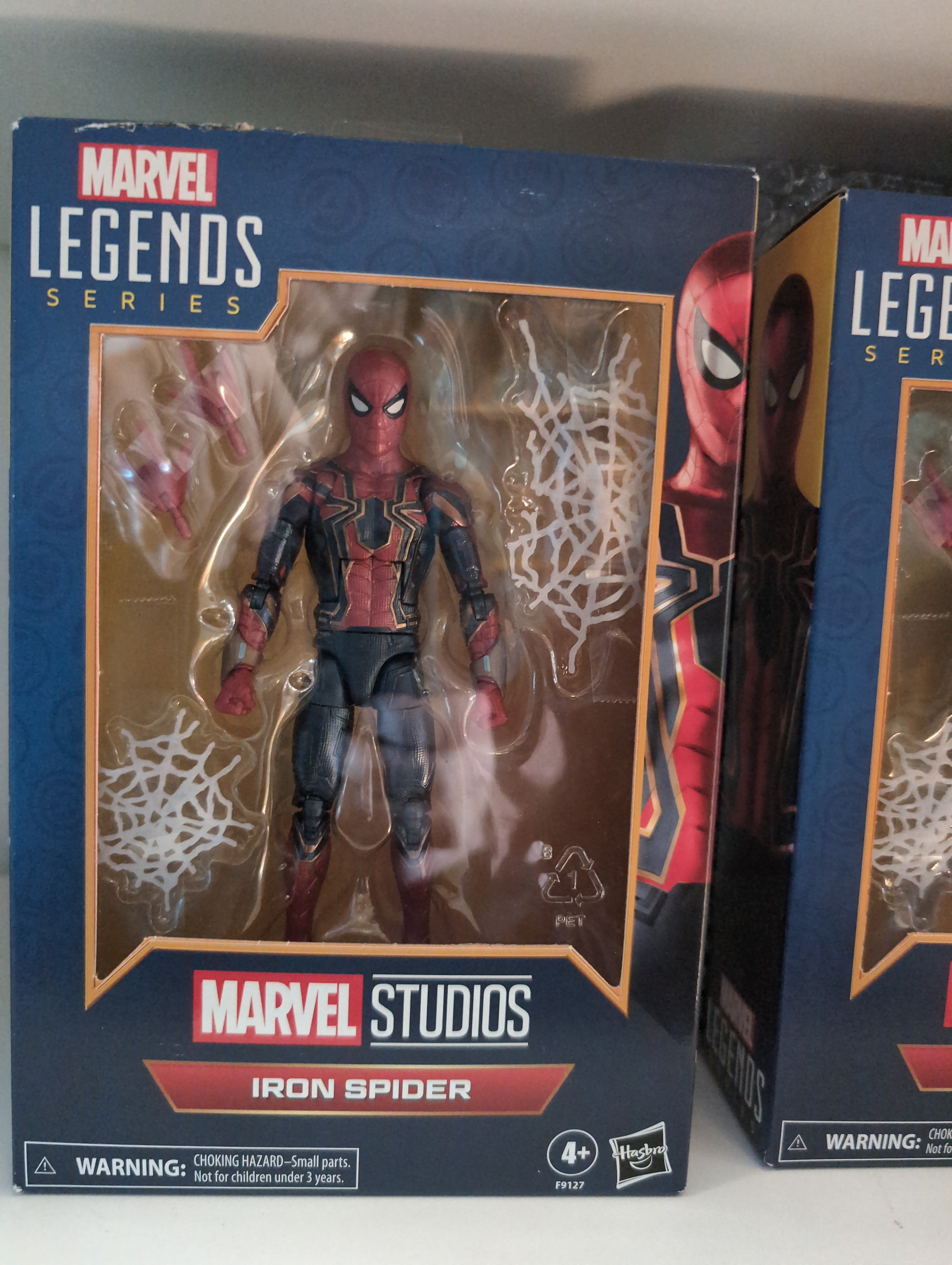 Marvel Legends Iron Spider action figure in box by Hasbro featuring detailed suit and accessories for ages 4 and up