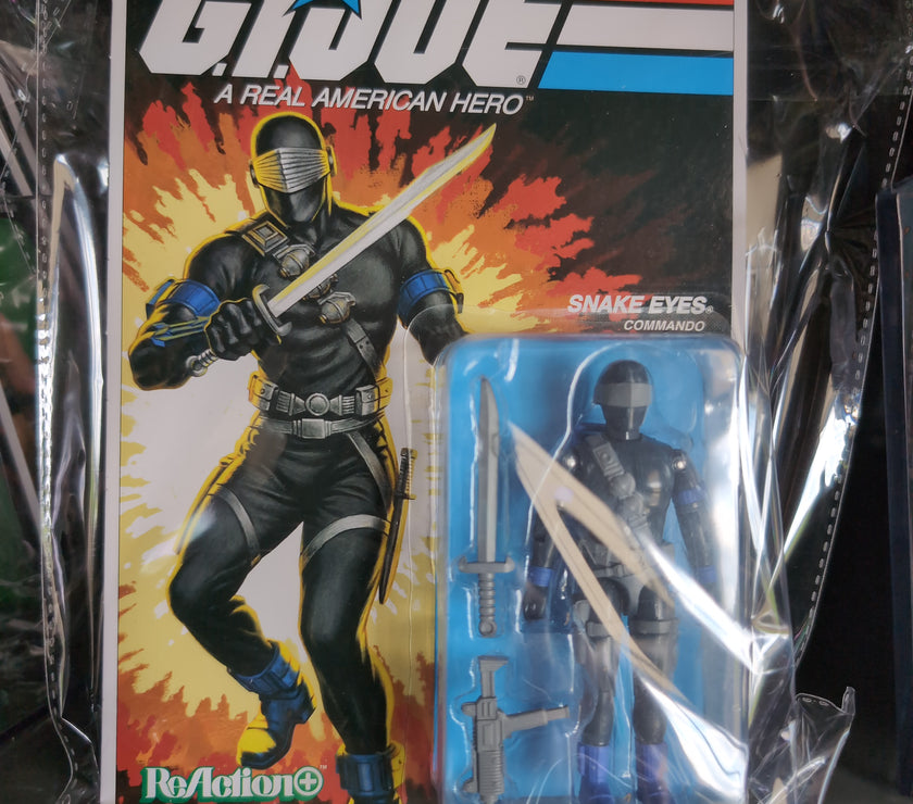 Hasbro G.I. Joe Snake Eyes Commando action figure in vintage style packaging with sword and accessories