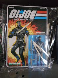 Hasbro G.I. Joe Snake Eyes Commando action figure in vintage style packaging with sword and accessories
