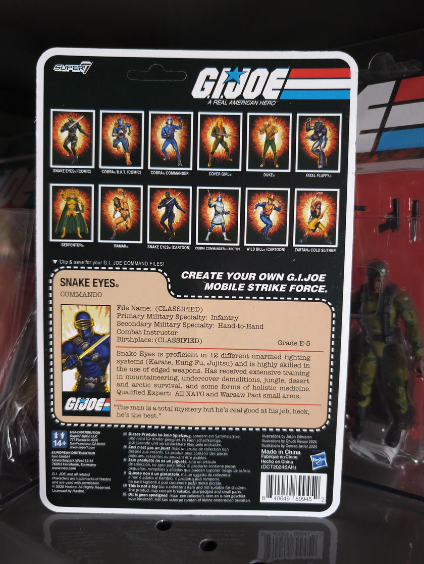 Hasbro G.I. Joe Snake Eyes Commando figure packaging showing character stats and other figures in the series.