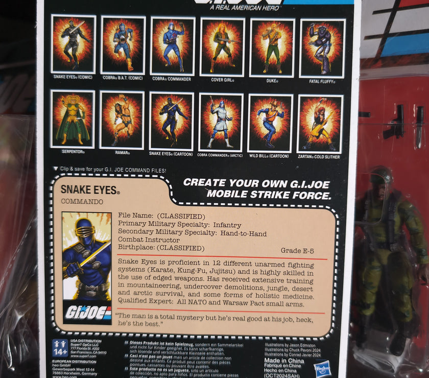 Hasbro G.I. Joe Snake Eyes Commando figure packaging showing character stats and other figures in the series.