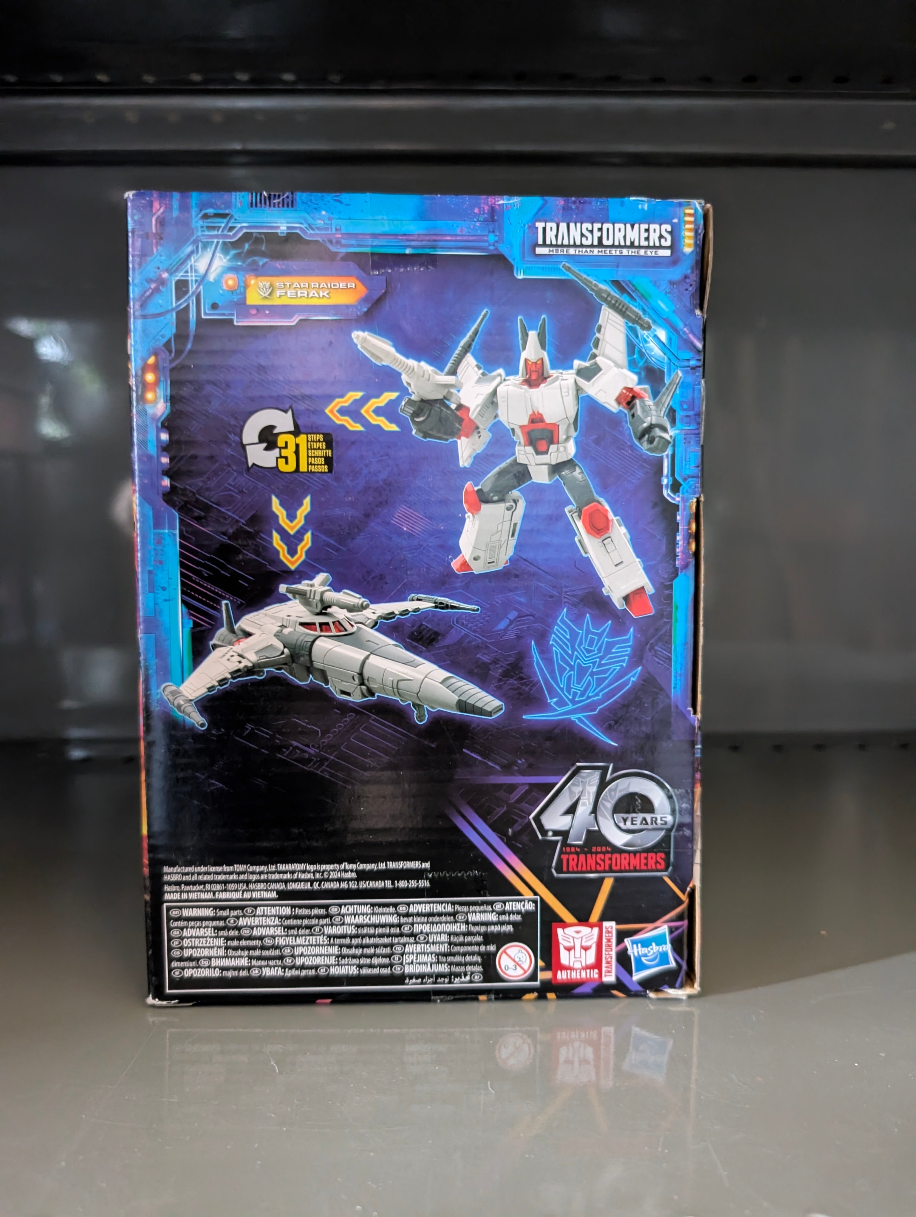 Box packaging for Voyager Star Raider Transformers Legacy United Collectable Action Figure by Hasbro showing robot and spaceship forms.