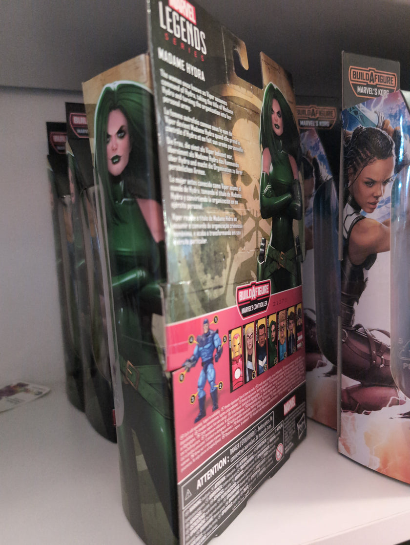 Hasbro Marvel Legends Madame Hydra action figure packaging showing character artwork and build-a-figure details.