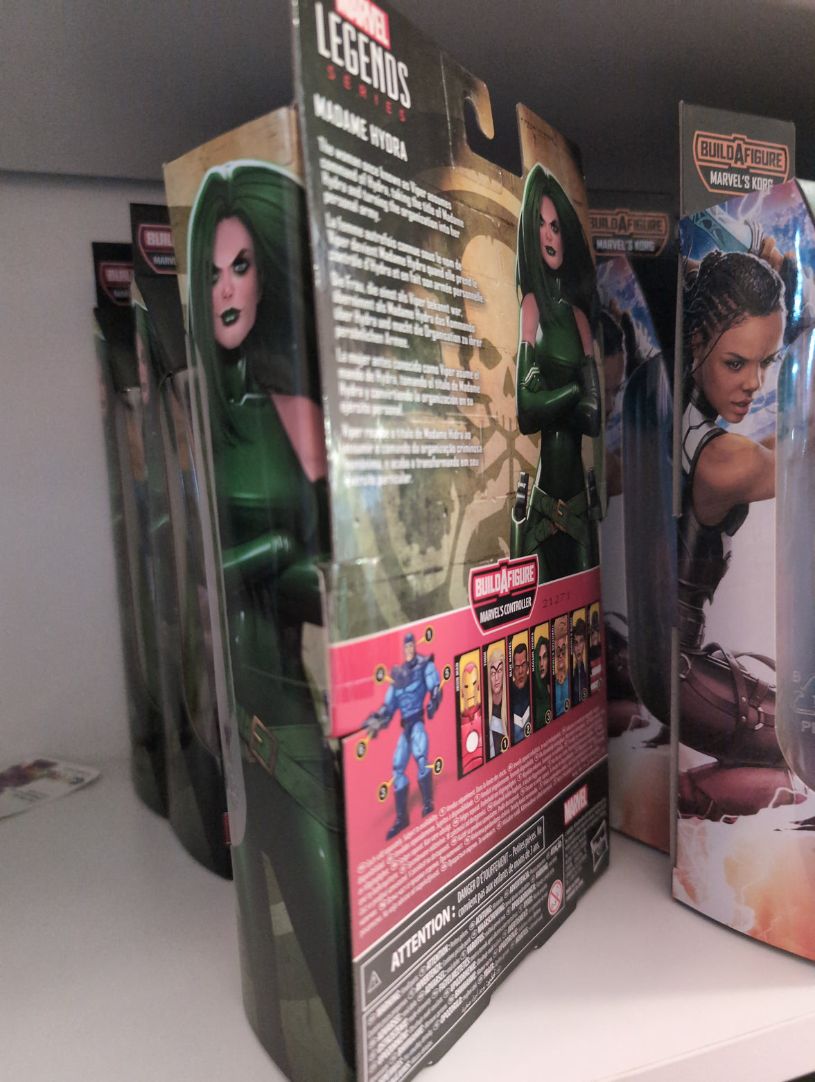 Hasbro Marvel Legends Madame Hydra action figure packaging showing character artwork and build-a-figure details.
