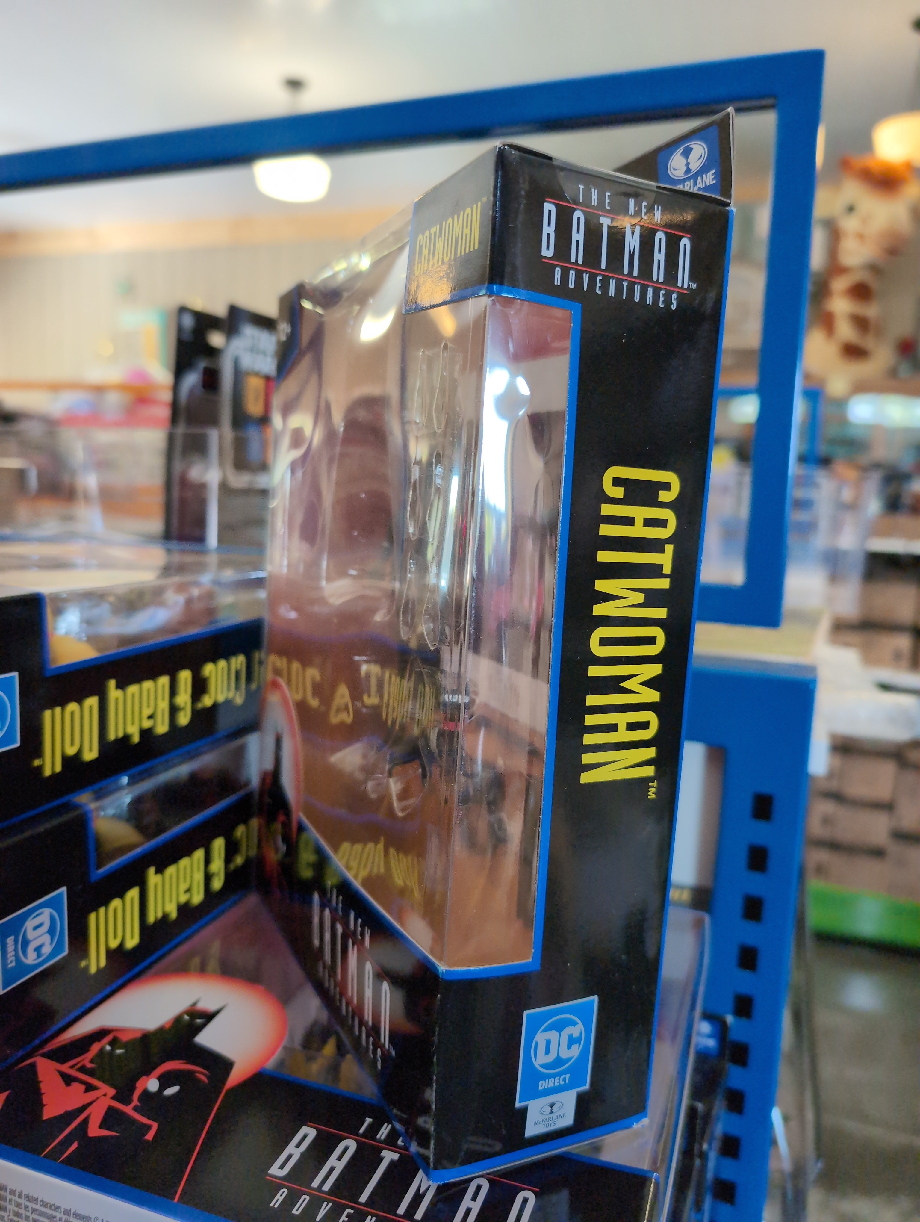 McFarlane Catwoman action figure from The New Batman Adventures in packaging on store shelf close-up angle