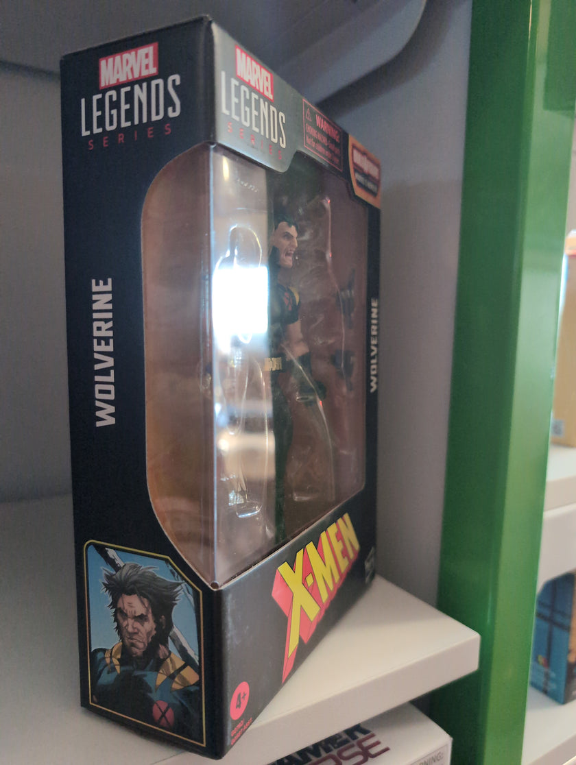 Hasbro Marvel Legends Wolverine X-Men 6-inch action figure in packaging with accessories visible on shelf