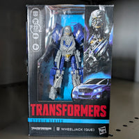 Wheeljack Transformers:Dark of the Moon Studio Series Action Figure by Hasbro in collectible packaging with robot and vehicle artwork.