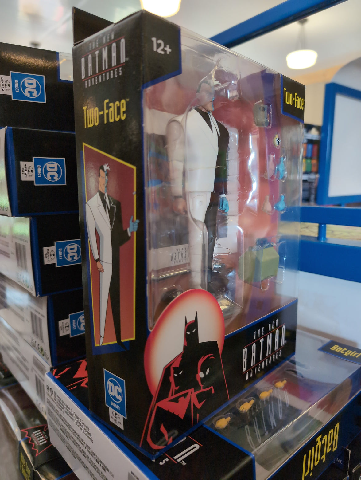 McFarlane Two-Face action figure from The New Batman Adventures in packaging with accessories and display base visible.