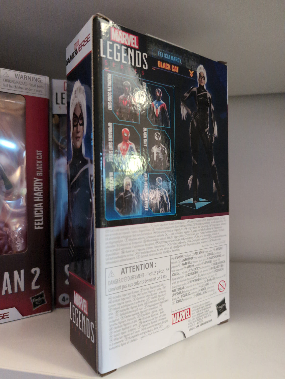 Hasbro Marvel Legends Black Cat action figure from Gamerverse Spider-Man 2 in detailed packaging on display shelf.
