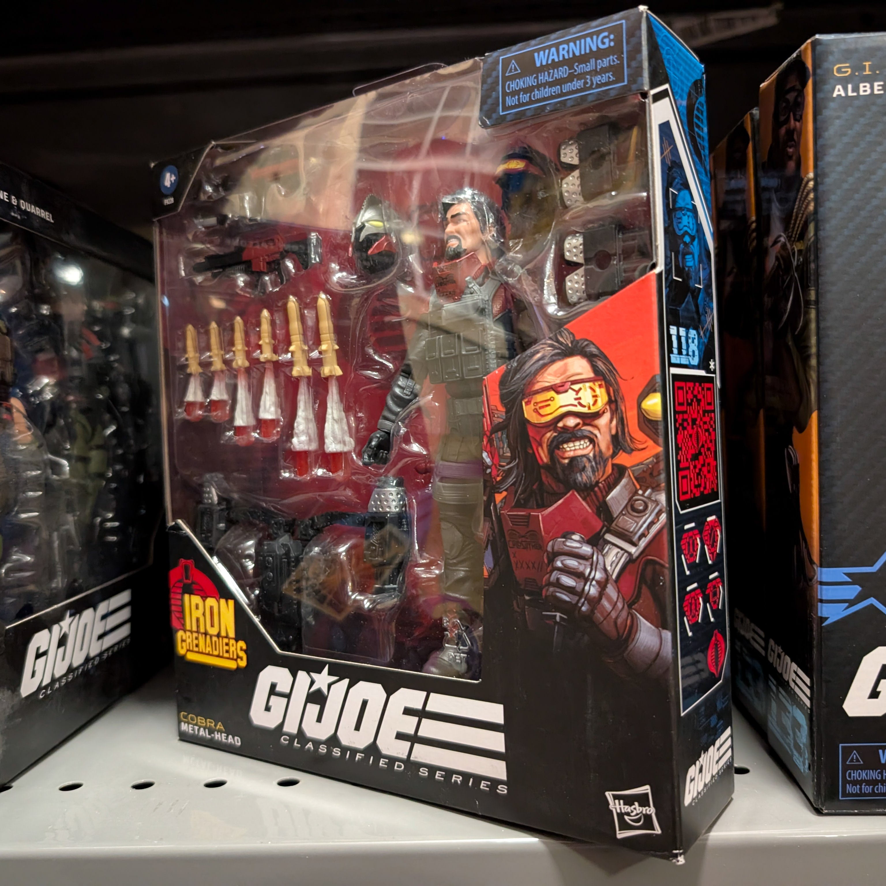 Hasbro GI Joe Classified Series Metal-Head Iron Grenadier 6-inch action figure with multiple accessories in box display