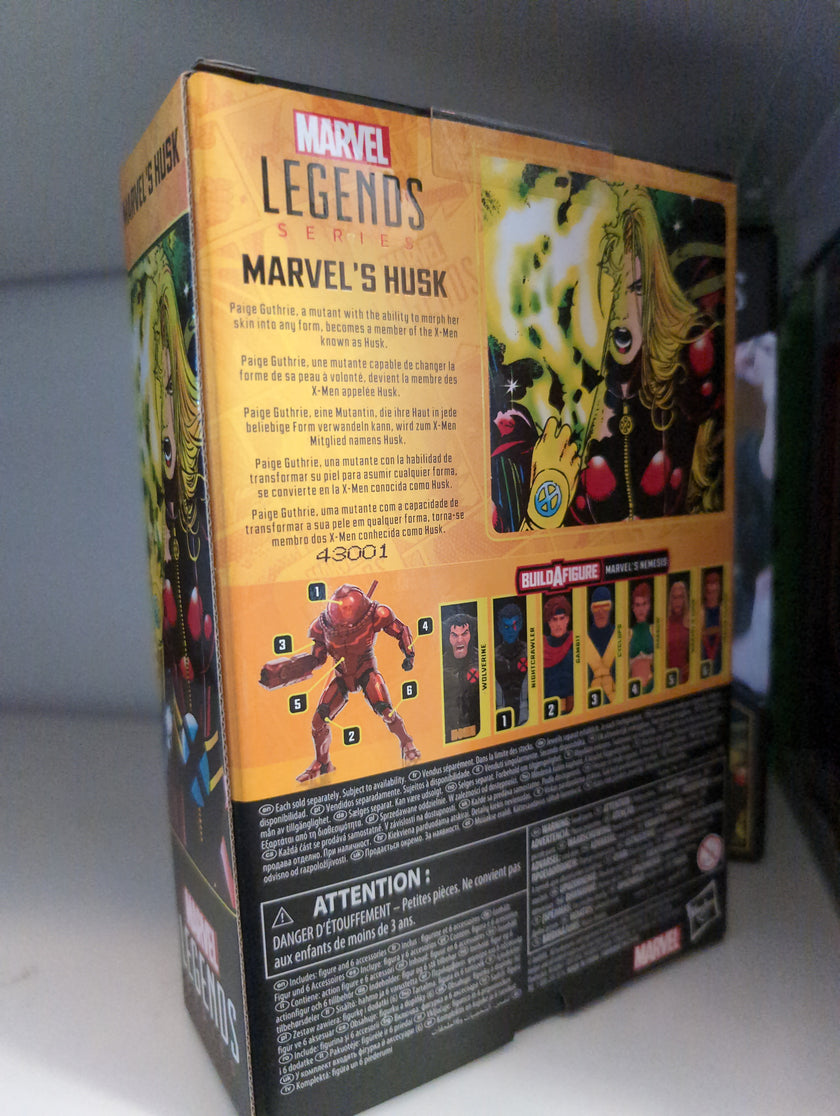 Hasbro Marvel Legends Husk action figure packaging showing character info and Build-A-Figure parts collection.