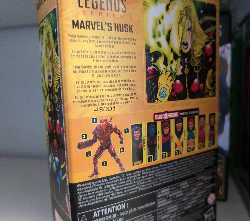 Hasbro Marvel Legends Husk action figure packaging showing character info and Build-A-Figure parts collection.