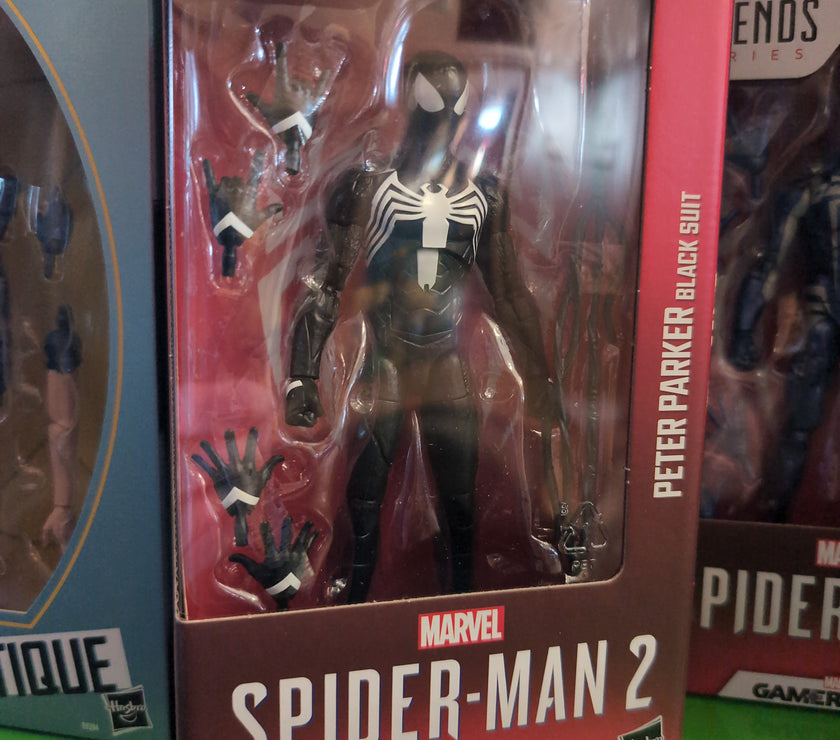 Hasbro Marvel Legends Peter Parker Black Suit Spider-Man 2 action figure with multiple hands in window box packaging