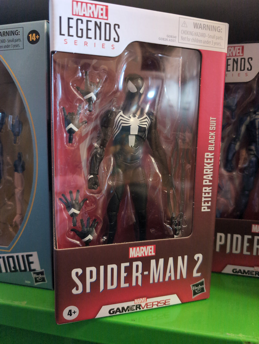 Hasbro Marvel Legends Peter Parker Black Suit Spider-Man 2 action figure with multiple hands in window box packaging