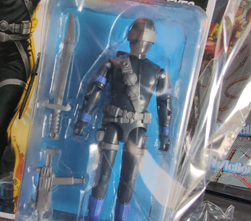 Hasbro Snake Eyes G.I. Joe ReAction+ figure in black tactical gear with sword and blaster accessories in packaging