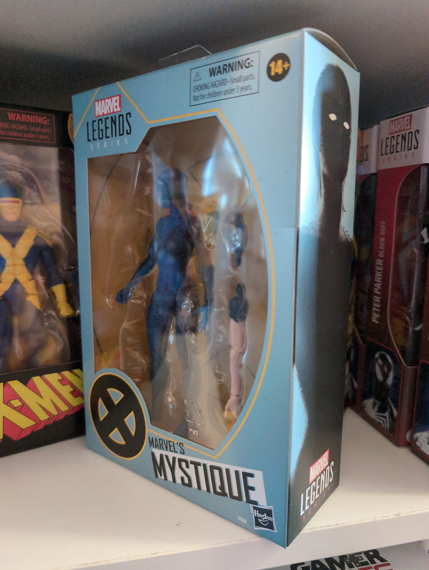 Hasbro Marvel Legends Mystique 6-inch action figure from X-Men series in collector packaging on display shelf
