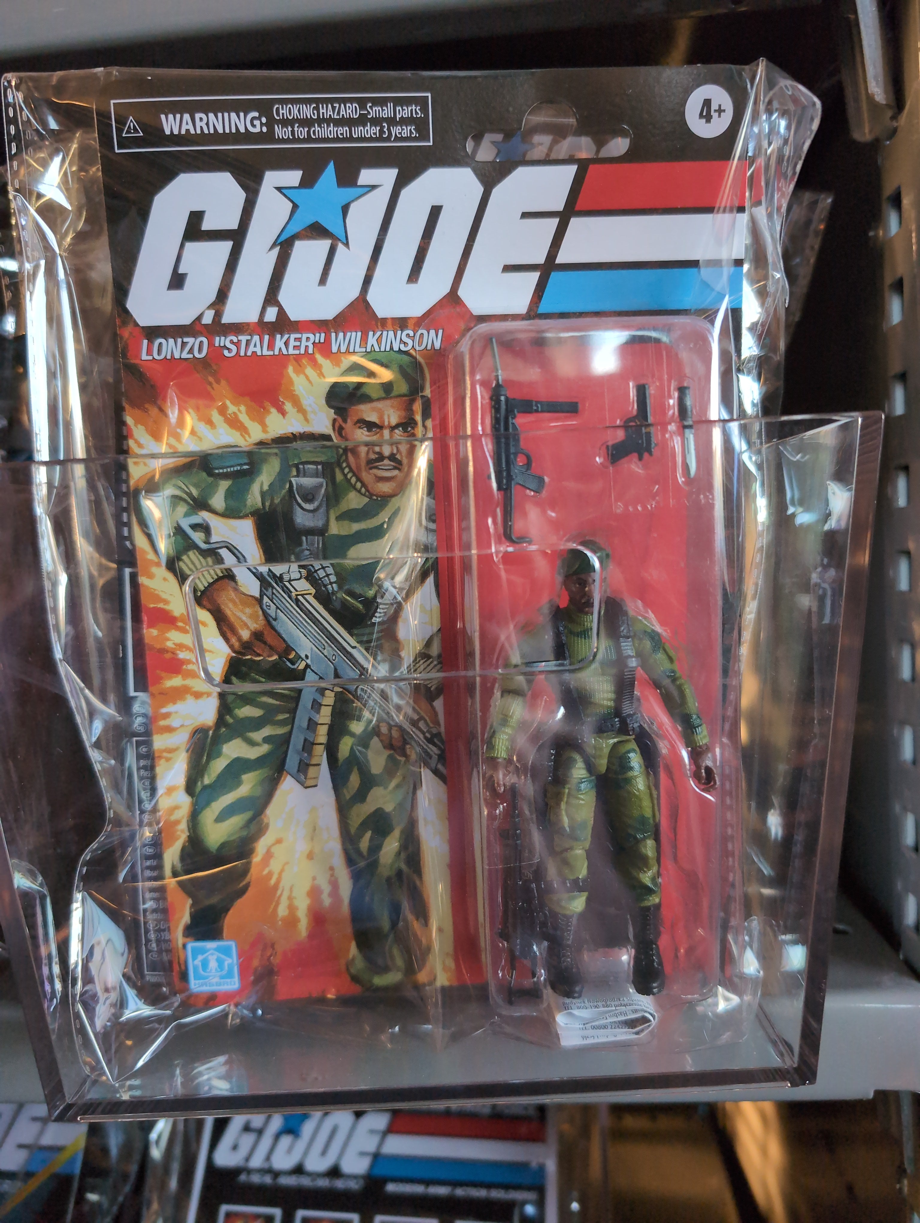 GI Joe Lonzo Stalker Wilkinson action figure in original Hasbro packaging with accessories and retro artwork.