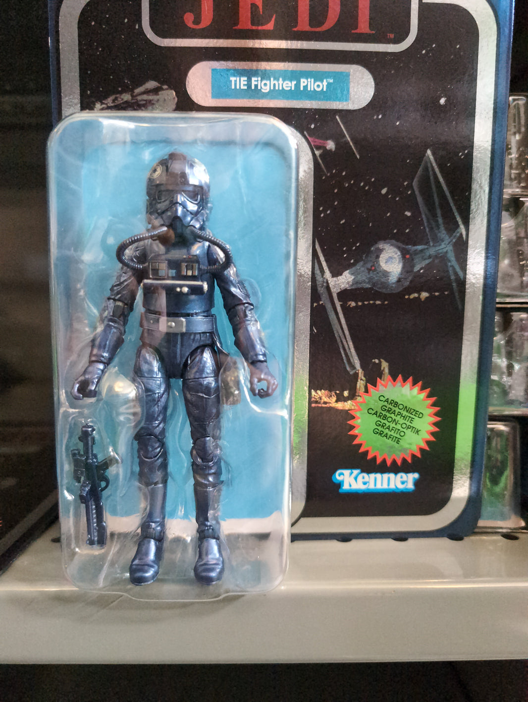 Hasbro Carbonized TIE Fighter Pilot action figure with metallic finish and blaster from Star Wars Black Series packaging